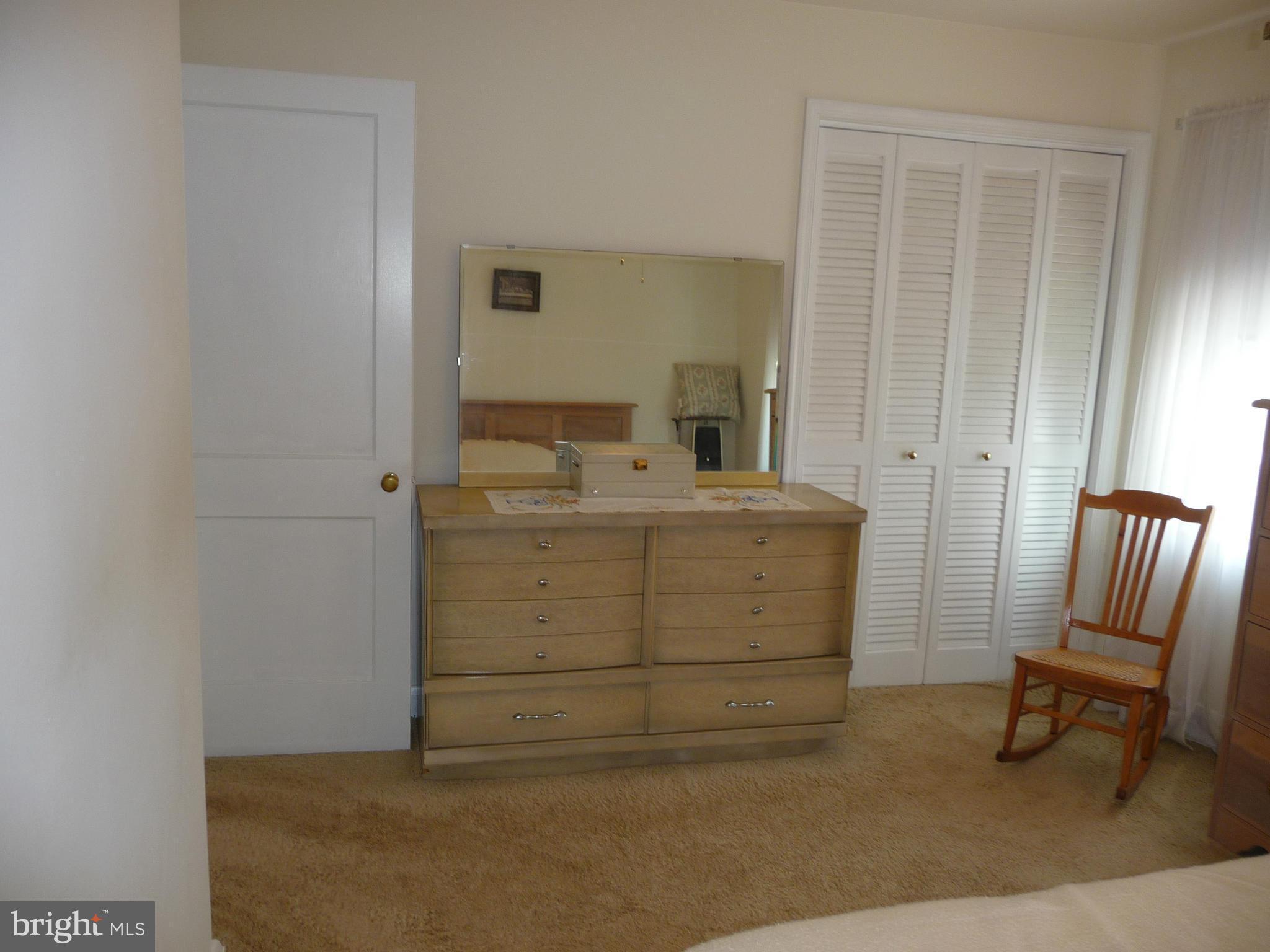 1751 Amuskai Road Baltimore, MD 21234 - Photo 13 of 27 a room with a furniture and a dresser