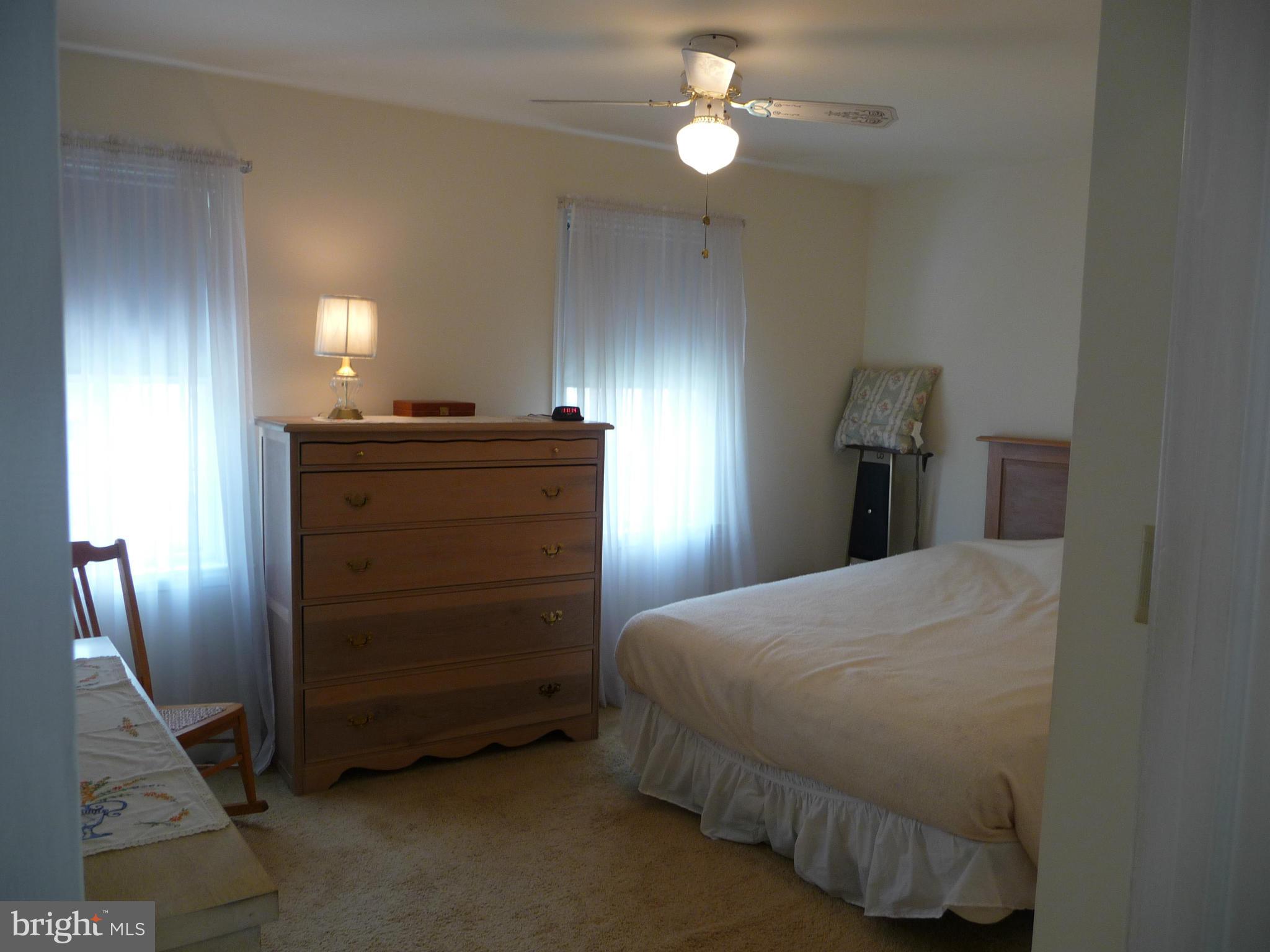 1751 Amuskai Road Baltimore, MD 21234 - Photo 14 of 27 a bedroom with a bed and a ceiling fan