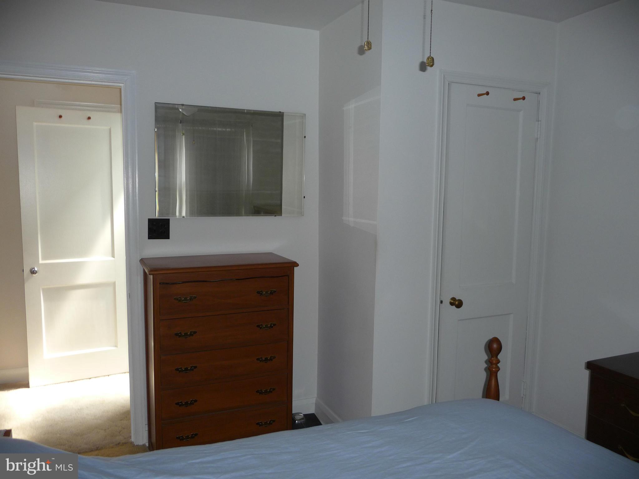 1751 Amuskai Road Baltimore, MD 21234 - Photo 19 of 27 a view of a hallway with wooden floor and cabinet