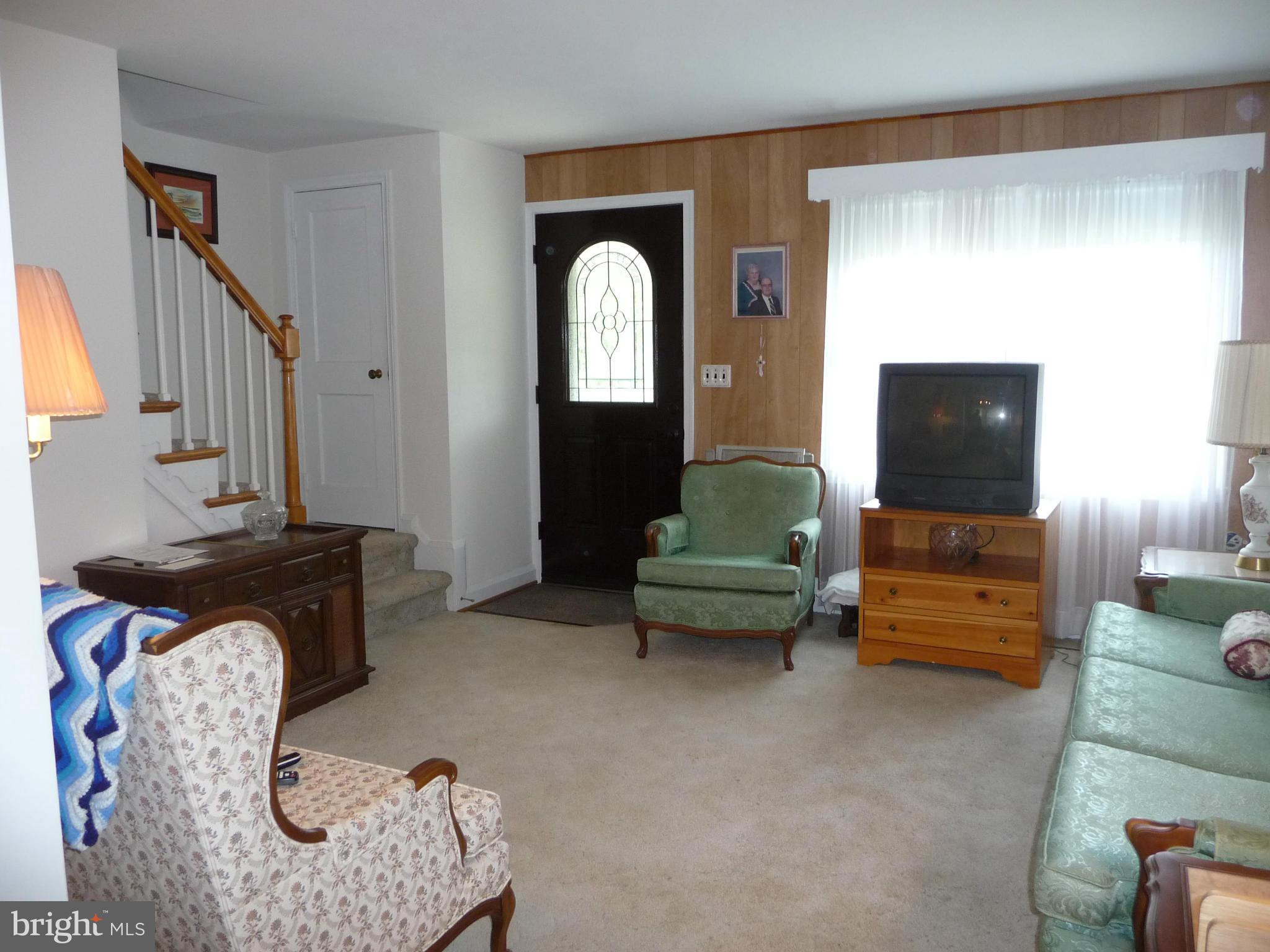 1751 Amuskai Road Baltimore, MD 21234 - Photo 3 of 27 a living room with furniture and a flat screen tv