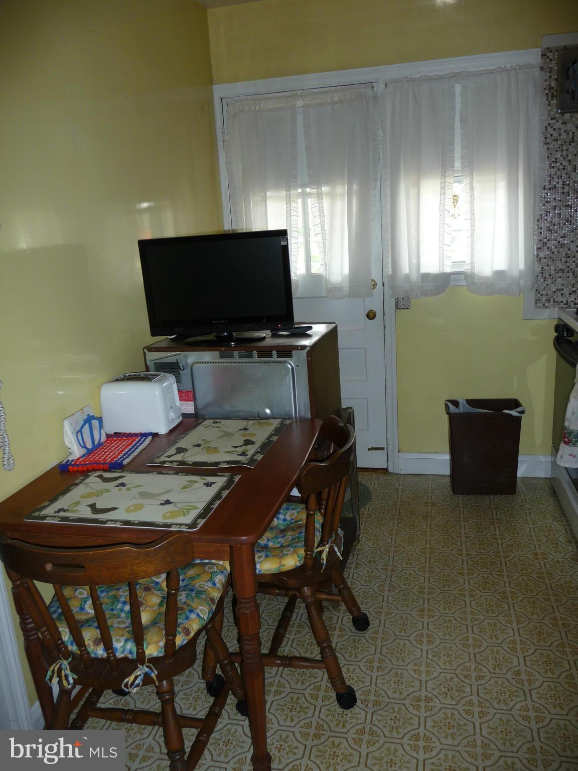 1751 Amuskai Road Baltimore, MD 21234 - Photo 8 of 27 a view of a livingroom with furniture and a flat screen tv