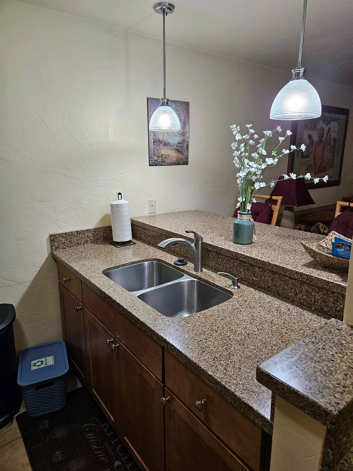 525 Aleka Loop, Unit K3 Kapaa, HI 96746 - Photo 13 of 14 a kitchen with sink and chandelier