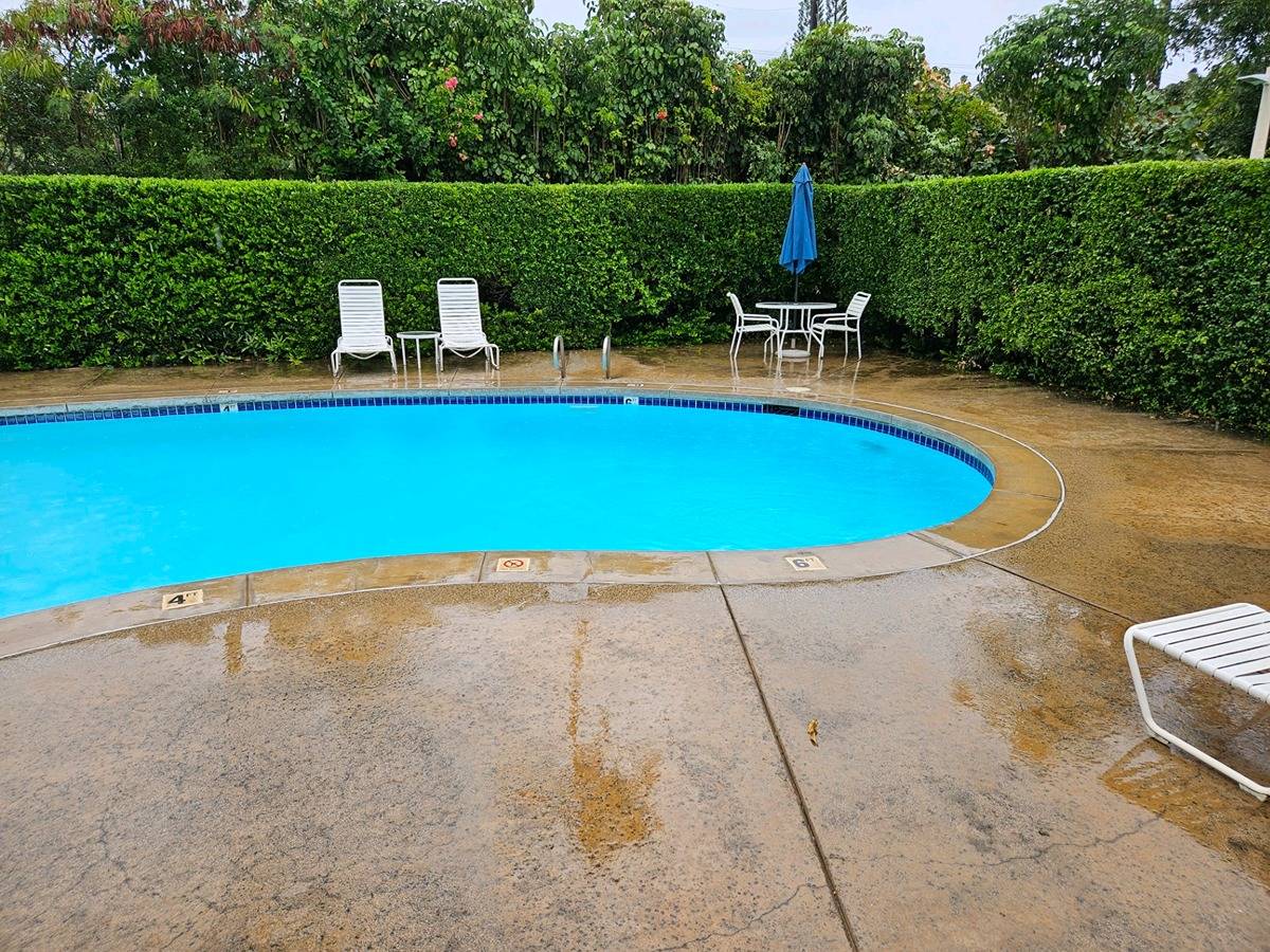 525 Aleka Loop, Unit K3 Kapaa, HI 96746 - Photo 2 of 14 a view of a swimming pool with a patio