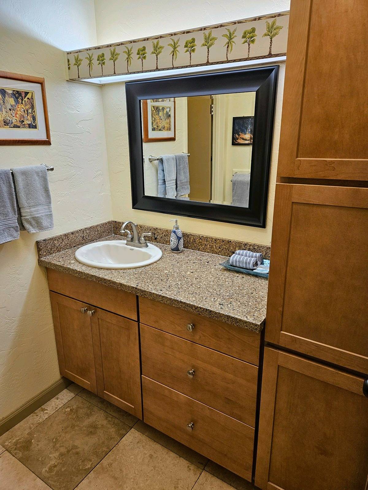 525 Aleka Loop, Unit K3 Kapaa, HI 96746 - Photo 6 of 14 a bathroom with a granite countertop sink and a mirror
