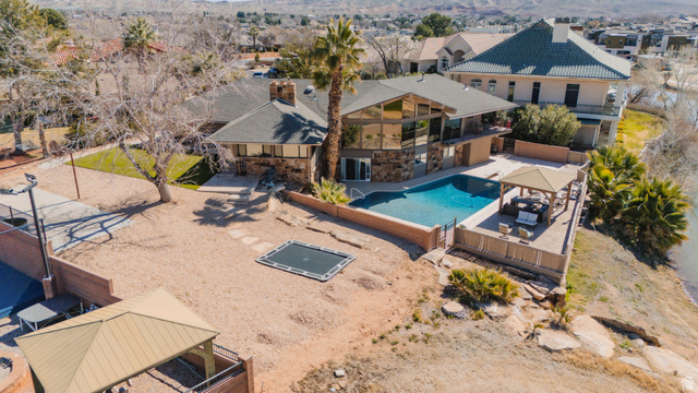 980 Cactus Circle St. George, UT 84790 - Photo 50 of 77 Aerial perspective of suburban area with a pool area