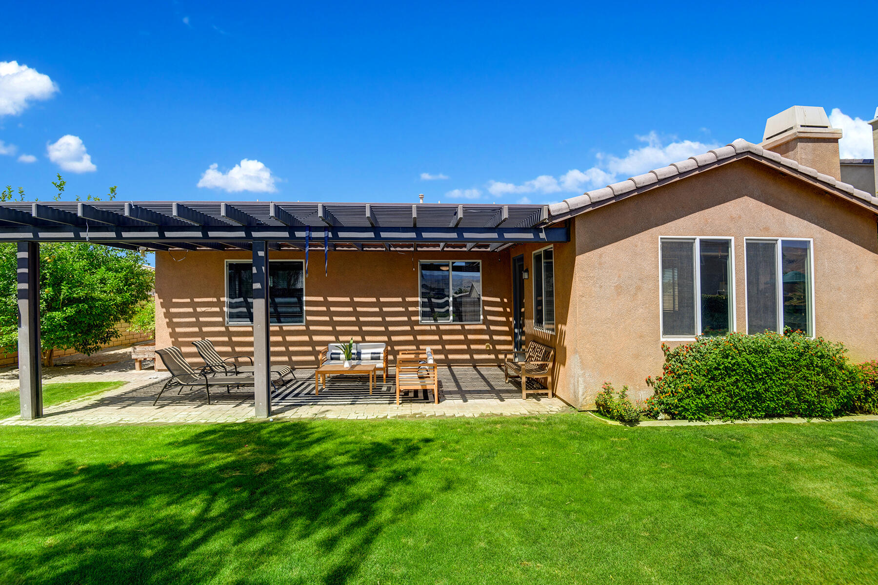 37232 Melbourne Street Indio, CA 92203 - Photo 28 of 30 a front view of a house with a yard
