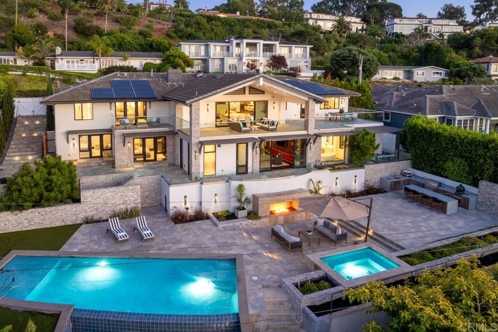 an aerial view of a house with swimming pool