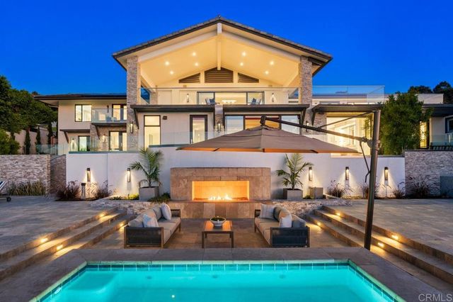 a kitchen with stainless steel appliances kitchen island granite countertop a sink and cabinets