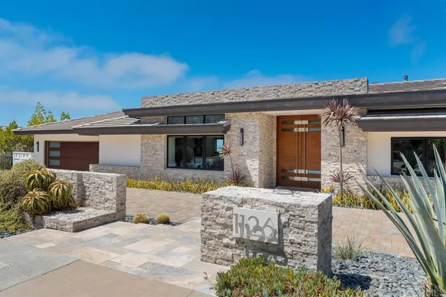 a room with furniture a flat screen tv and a window