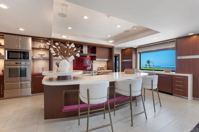 a bed room with a bed and a large window