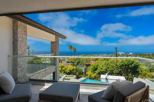 a spacious bathroom with a granite countertop sink and a mirror