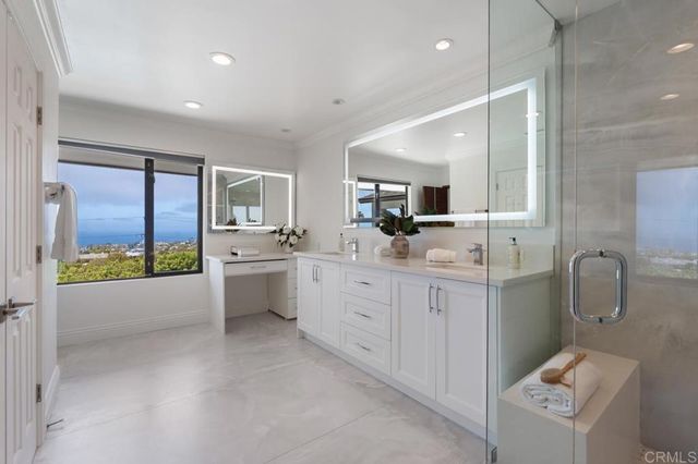 a bedroom with a large bed and a large window