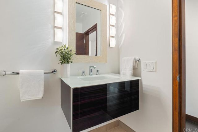 a bedroom with a large bed and a large window