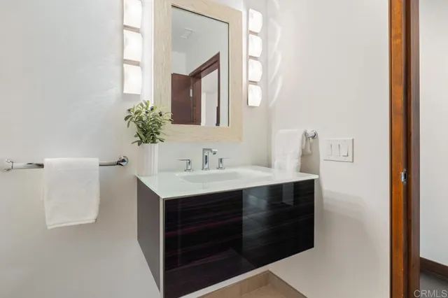 a bedroom with a large bed and a large window