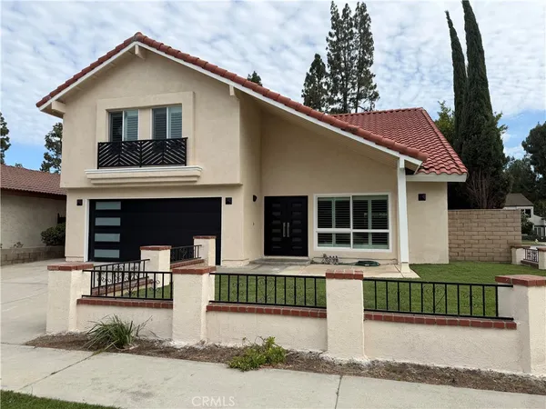 a front view of a house with garage
