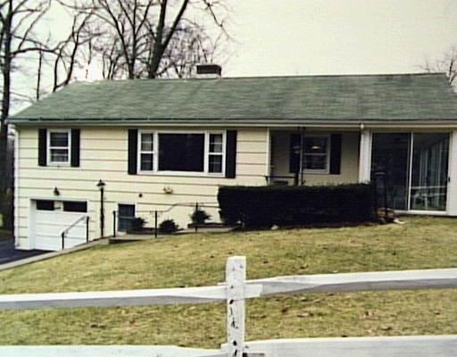 19 Powder Horn Road Norwalk, CT 06850 - Photo 1 of 1 a view of a house with a yard