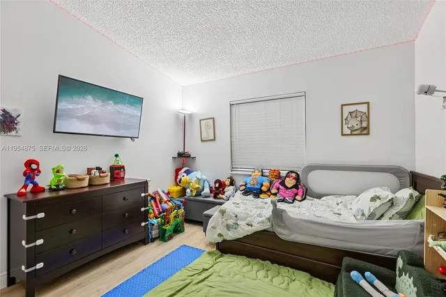 a view of a workspace with furniture and toys