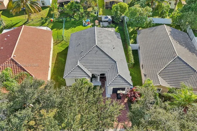 a view of chairs and potted plants