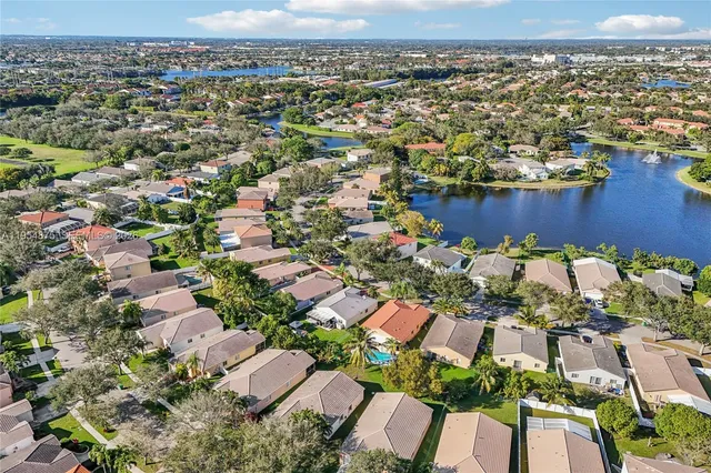 an aerial view of a house with yard swimming pool and outdoor seating