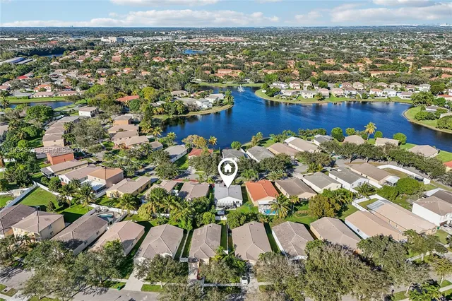 an aerial view of house with pool