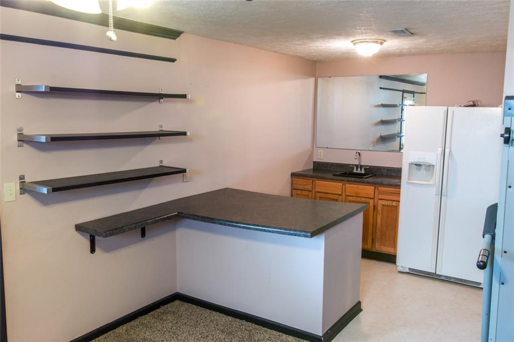206 Becks Run Road Coraopolis, PA 15108 - Photo 22 of 25 Wet bar and refrigerator in the basement