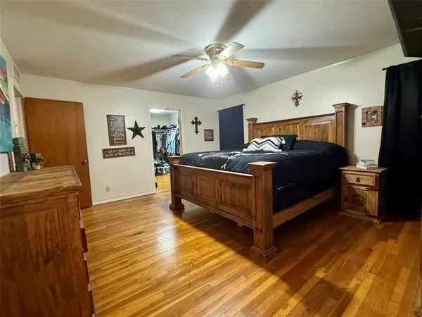 a bedroom with furniture and a window