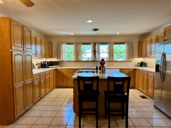 a view of a livingroom with furniture and a flat screen tv