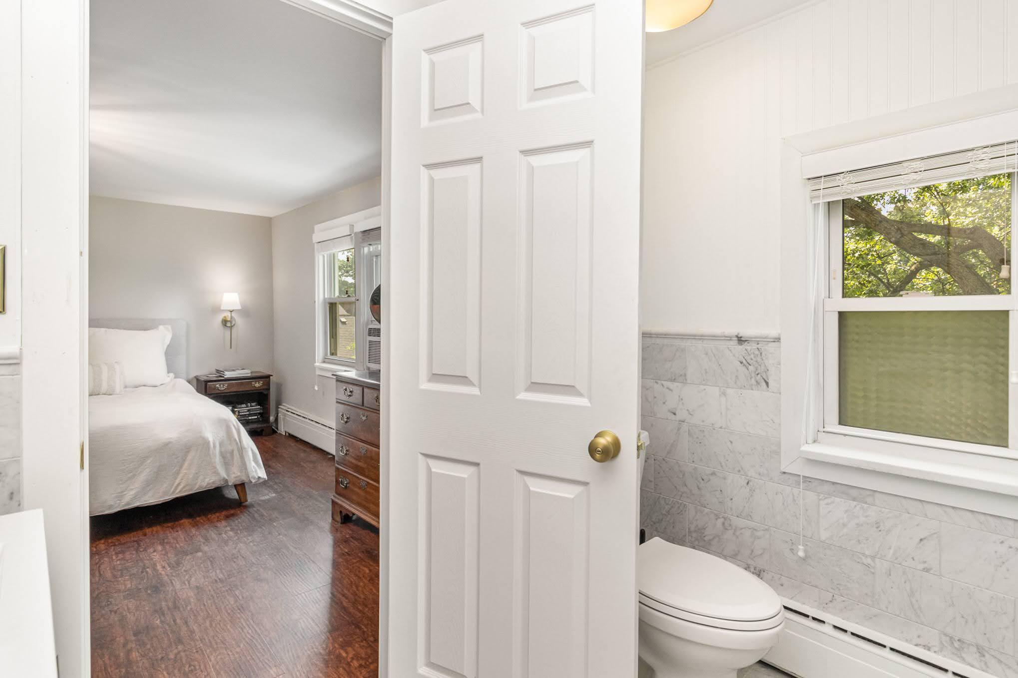 3444 Ridge Road Highland, IN 46322 - Photo 24 of 47 a en suite bathroom with a toilet a sink and a window