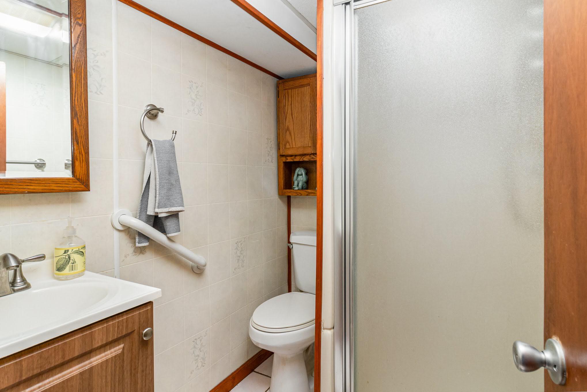 3444 Ridge Road Highland, IN 46322 - Photo 31 of 47 a bathroom with a sink toilet and a mirror