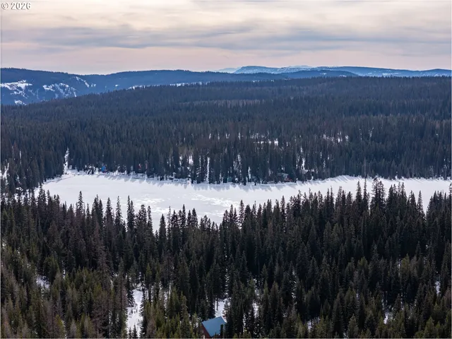 a view of a park with swings and slides