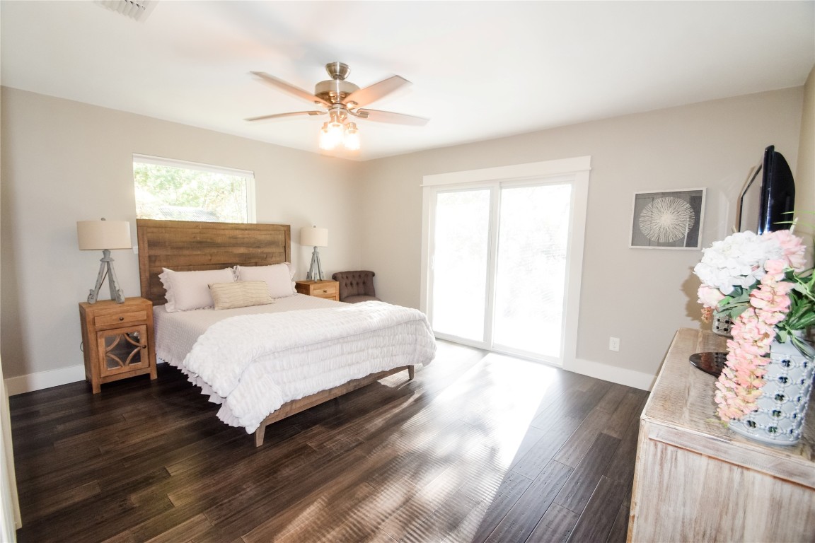 3618 Quiette Drive Austin, TX 78754 - Photo 11 of 31 a bedroom with a bed and wooden floor