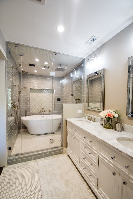 3618 Quiette Drive Austin, TX 78754 - Photo 13 of 31 a spacious bathroom with a double vanity sink and a mirror