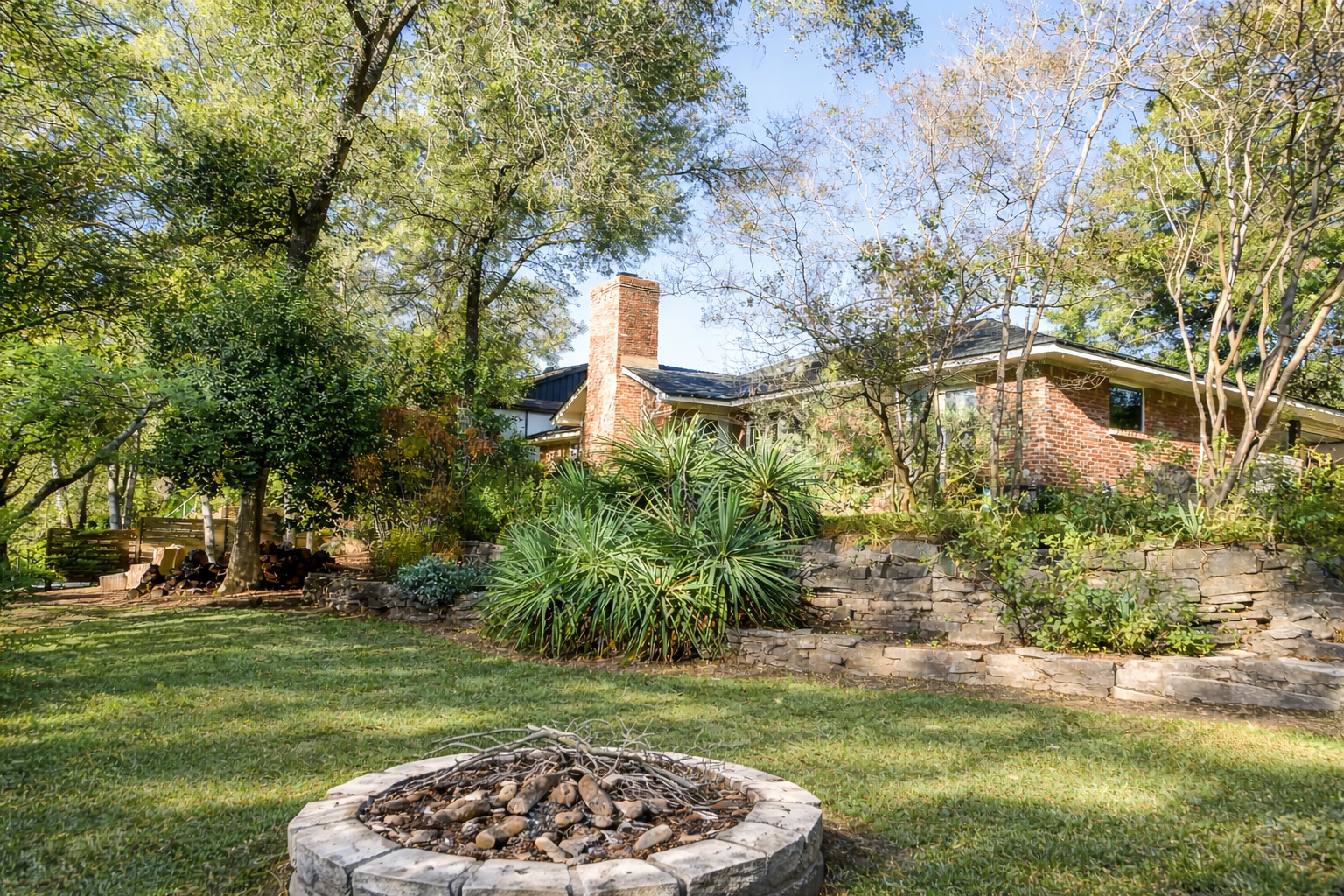 3618 Quiette Drive Austin, TX 78754 - Photo 21 of 37 a backyard of a house with lots of green space and fountain