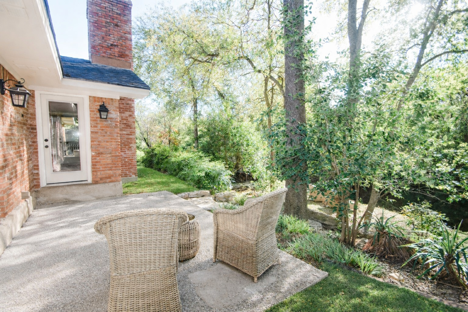 3618 Quiette Drive Austin, TX 78754 - Photo 26 of 37 a view of a patio with couches table and chairs and potted plants