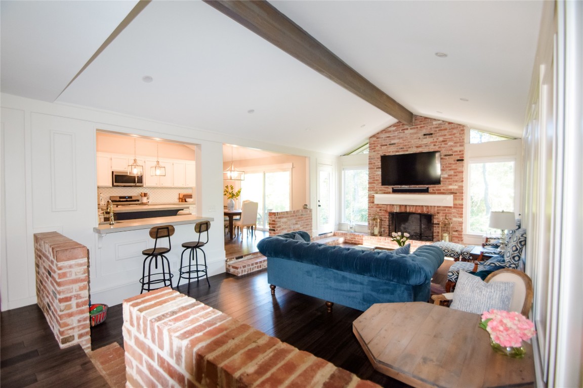 3618 Quiette Drive Austin, TX 78754 - Photo 3 of 31 a living room with furniture a fireplace and a flat screen tv