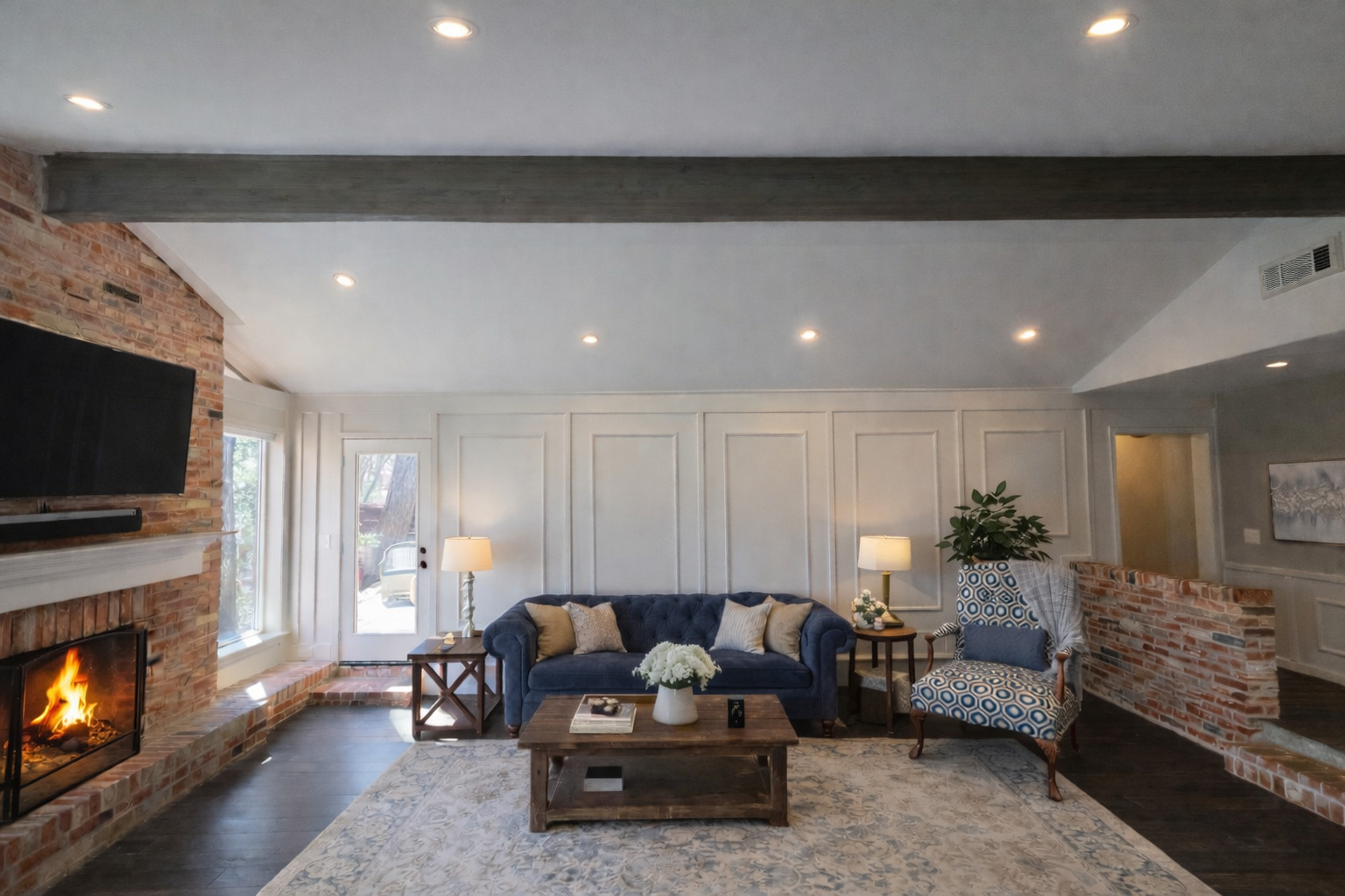 3618 Quiette Drive Austin, TX 78754 - Photo 4 of 37 Living area featuring a decorative wall, a brick fireplace, vaulted ceiling with beams, wood finished floors, and recessed lighting