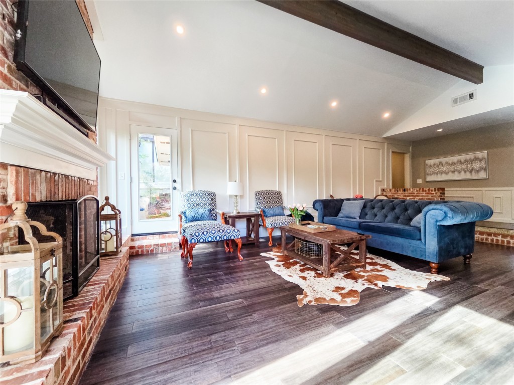 3618 Quiette Drive Austin, TX 78754 - Photo 5 of 31 a living room with furniture a fireplace and a flat screen tv