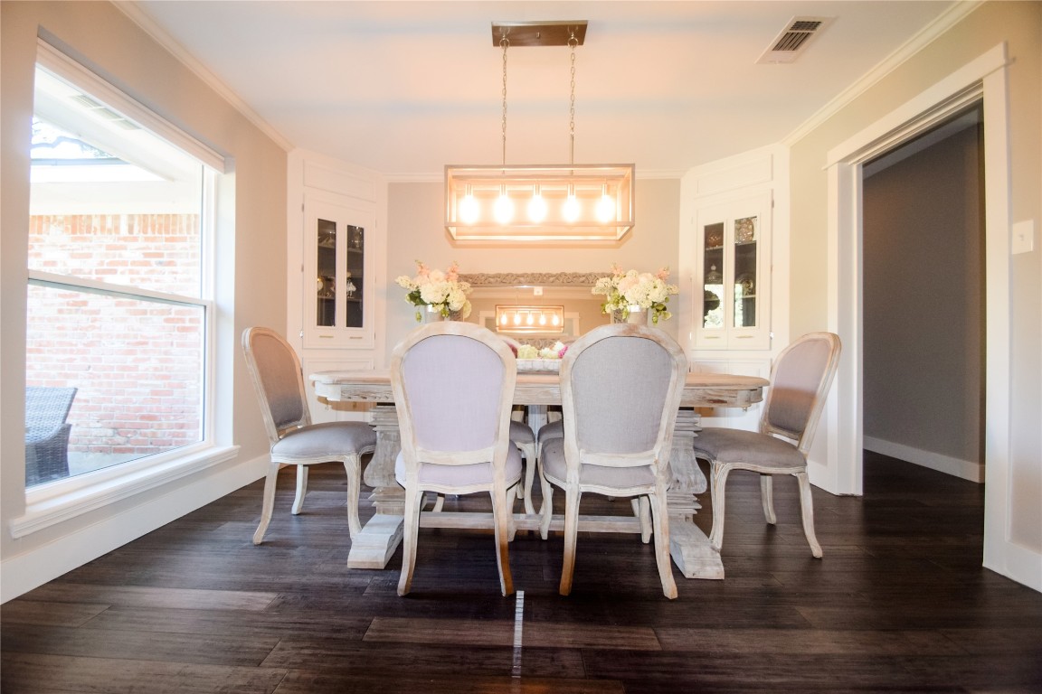 3618 Quiette Drive Austin, TX 78754 - Photo 7 of 31 a view of a dining room with furniture window and wooden floor