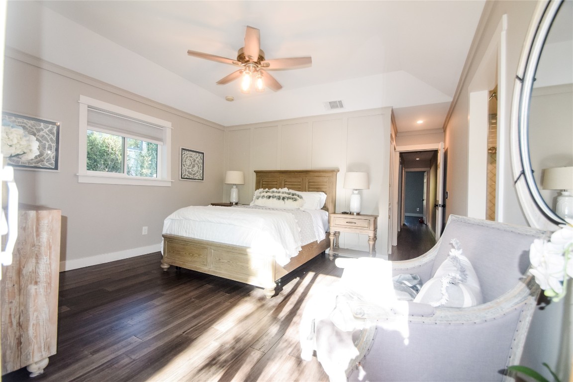 3618 Quiette Drive Austin, TX 78754 - Photo 9 of 31 a bedroom with a bed and a chandelier