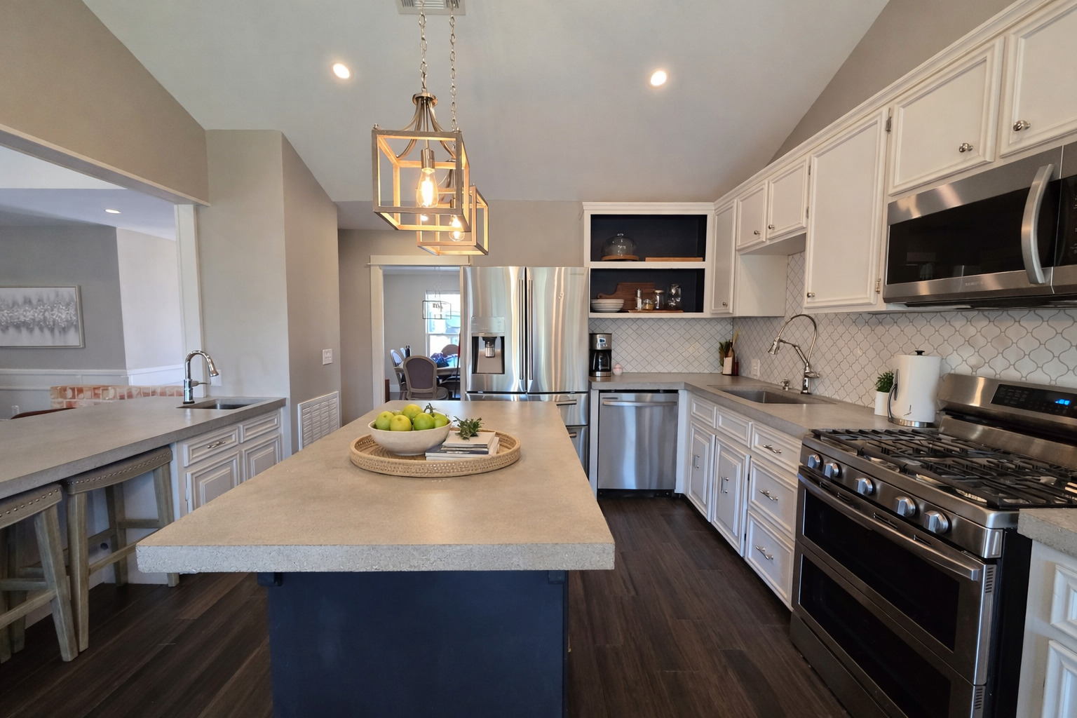 3618 Quiette Drive Austin, TX 78754 - Photo 8 of 37 Kitchen featuring stainless steel appliances, vaulted ceiling, pendant lighting, light countertops, and a kitchen island
