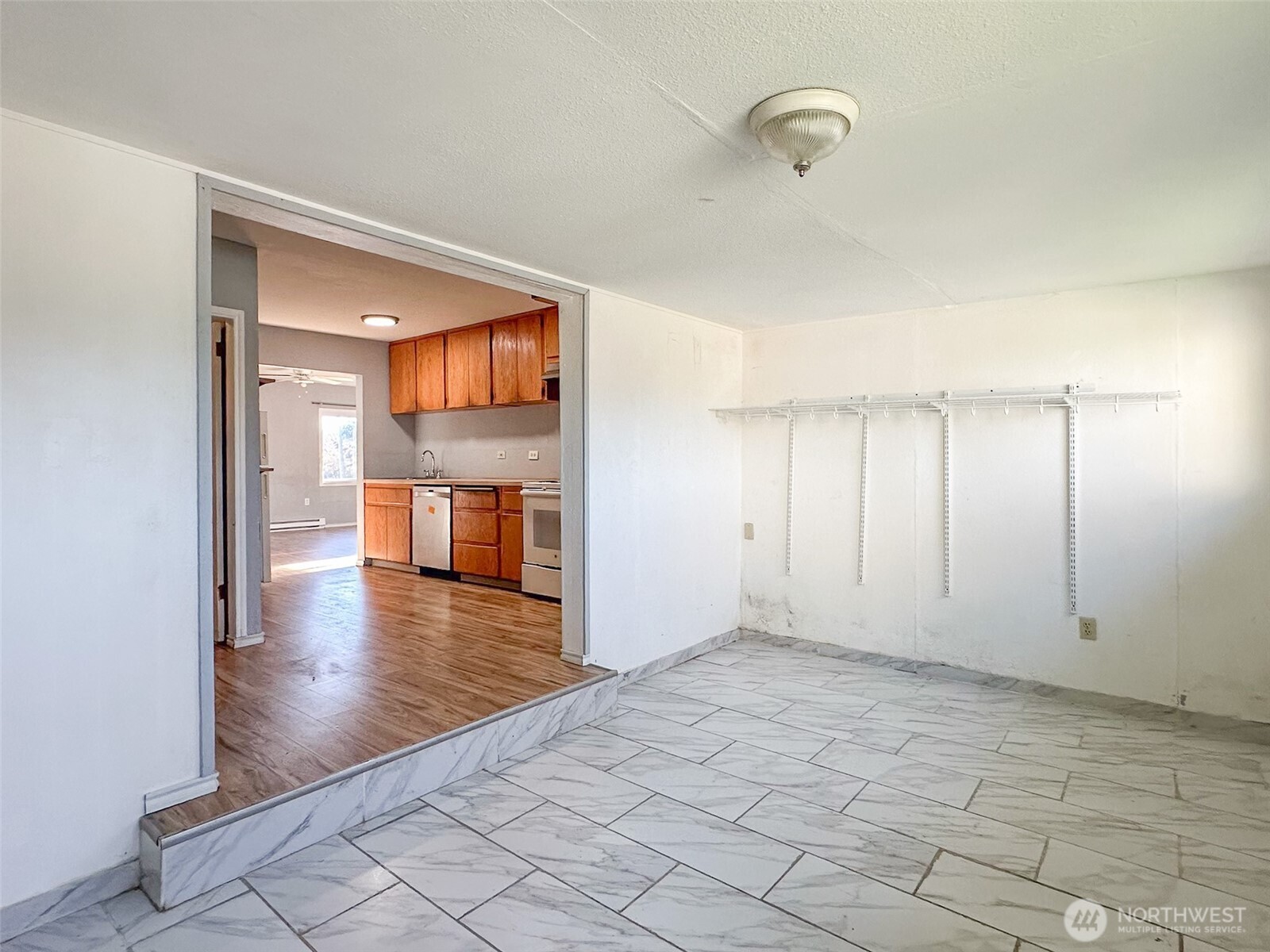 1222 West Schley Street Aberdeen, WA 98520 - Photo 16 of 31 an empty room with wooden floor and windows