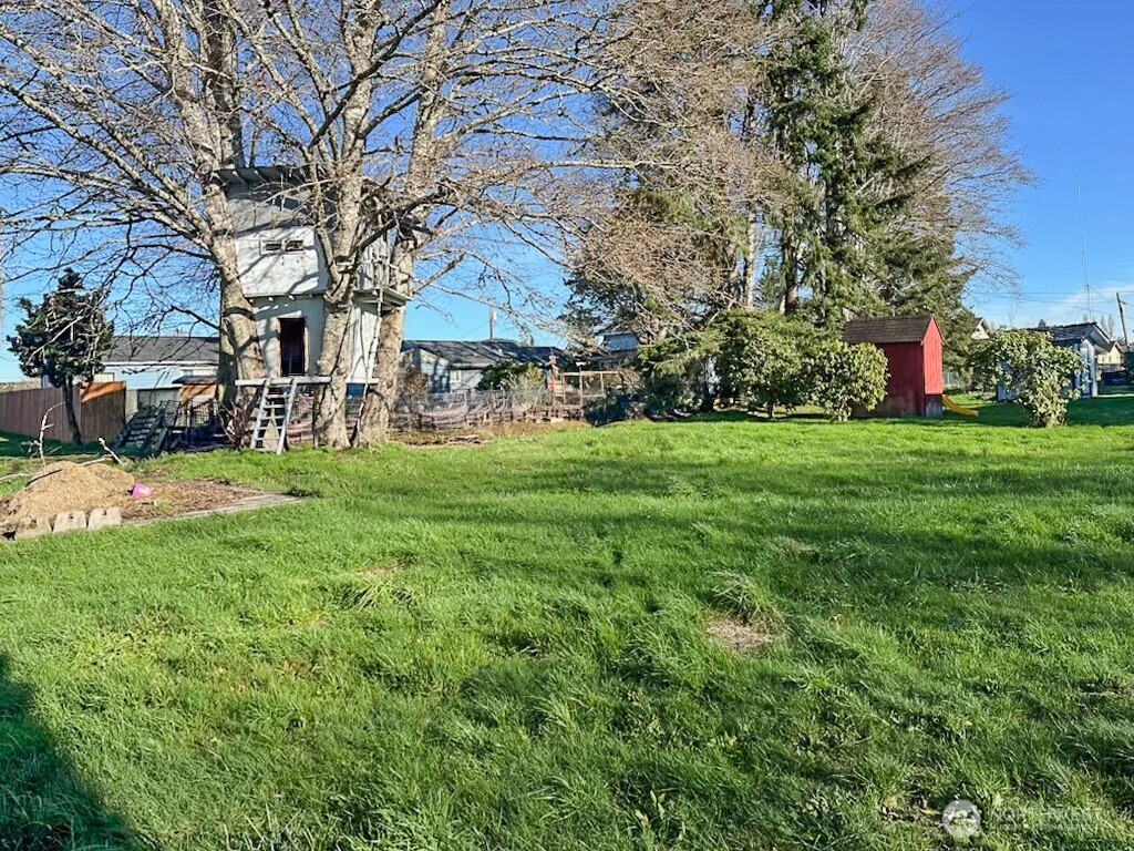 1222 West Schley Street Aberdeen, WA 98520 - Photo 30 of 31 a view of a house with a yard