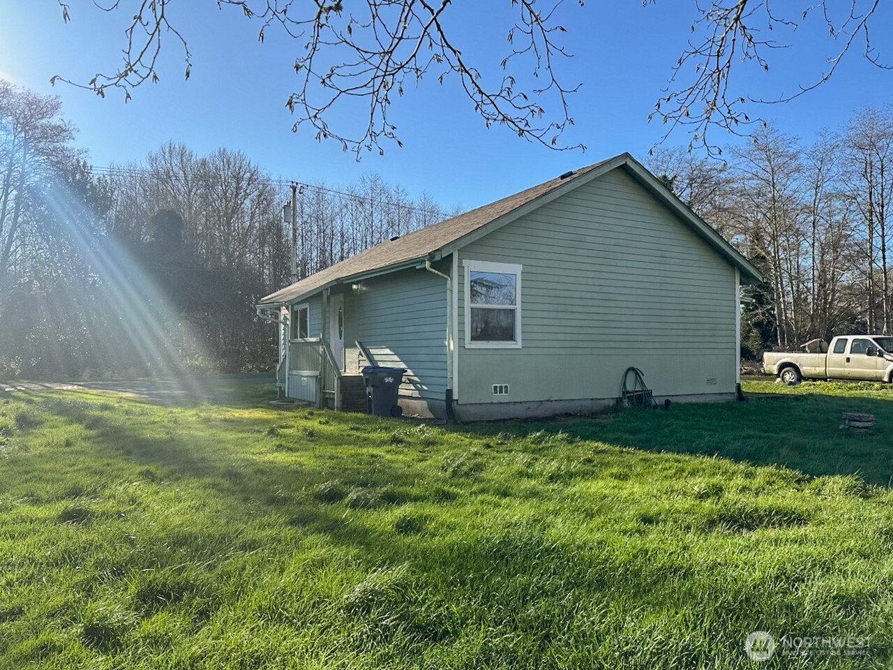 1222 West Schley Street Aberdeen, WA 98520 - Photo 6 of 31 a backyard of a house with plants and large tree