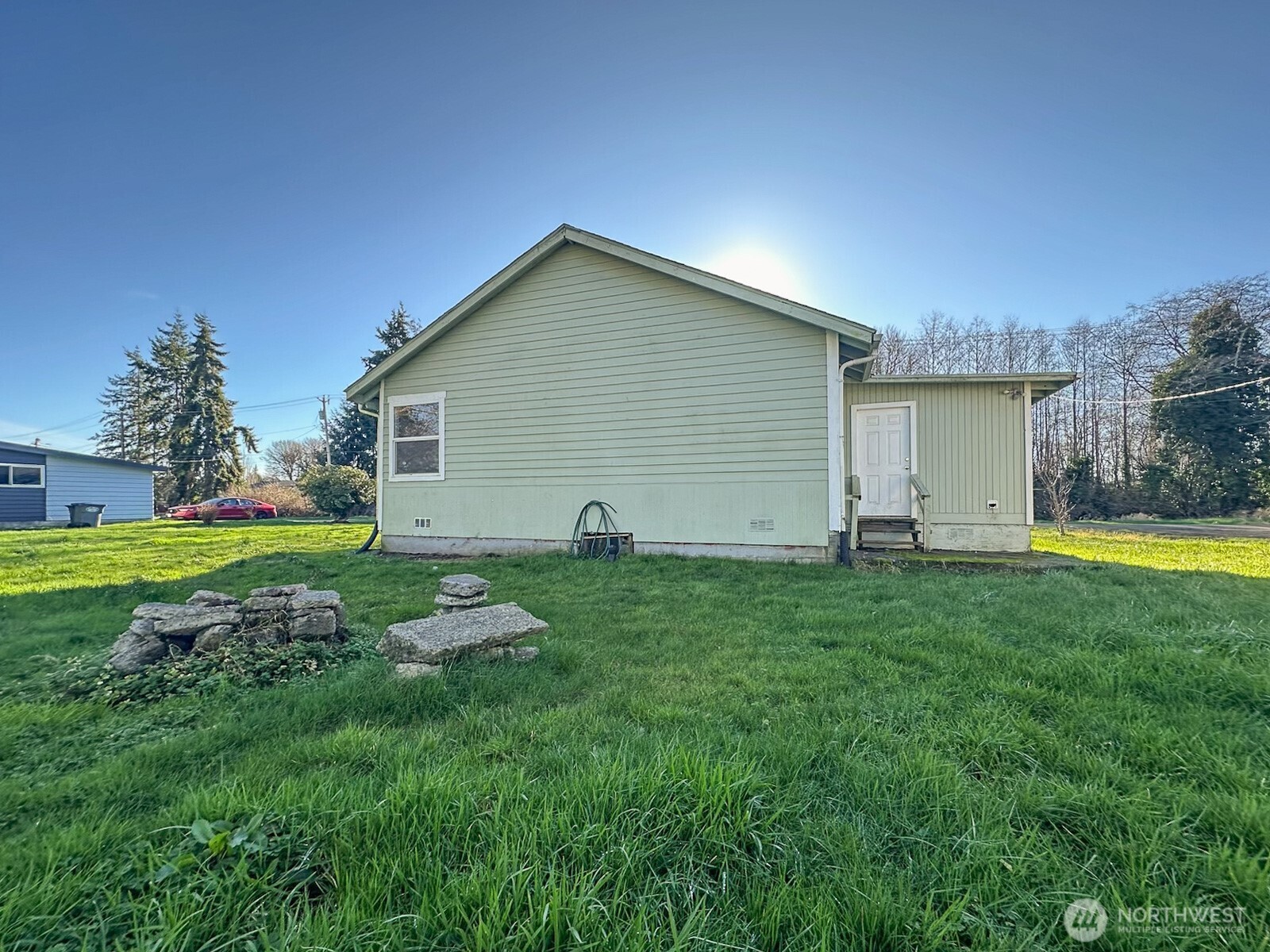 1222 West Schley Street Aberdeen, WA 98520 - Photo 7 of 31 a backyard of a house with plants and wooden fence