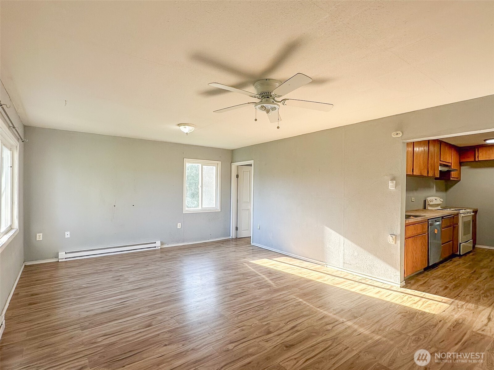 1222 West Schley Street Aberdeen, WA 98520 - Photo 8 of 31 wooden floor in an empty room with a window