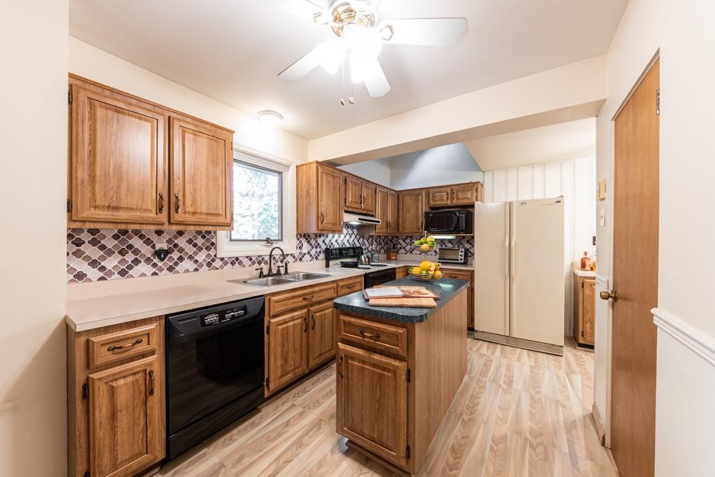 219 Castlegate Road Pittsburgh, PA 15221 - Photo 8 of 25 The heart of every home, this kitchen layout works well for many helping hands.