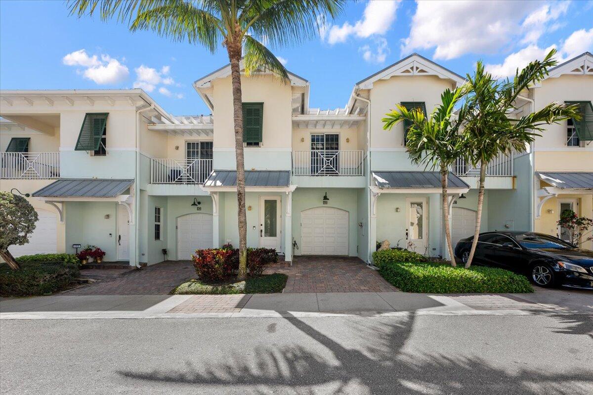 455 Ocean Ridge Way Juno Beach, FL 33408 - Photo 2 of 45 a view of multiple house with a yard and potted plants