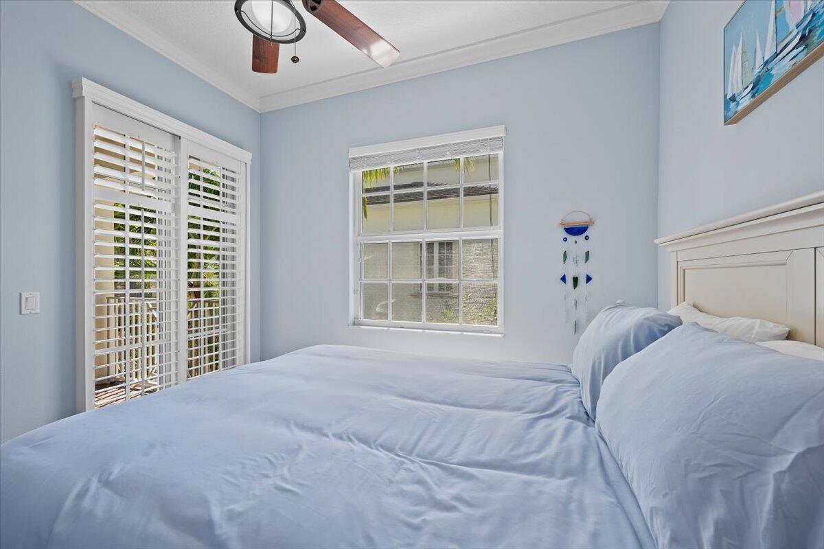 455 Ocean Ridge Way Juno Beach, FL 33408 - Photo 22 of 45 a bedroom with a bed and a window