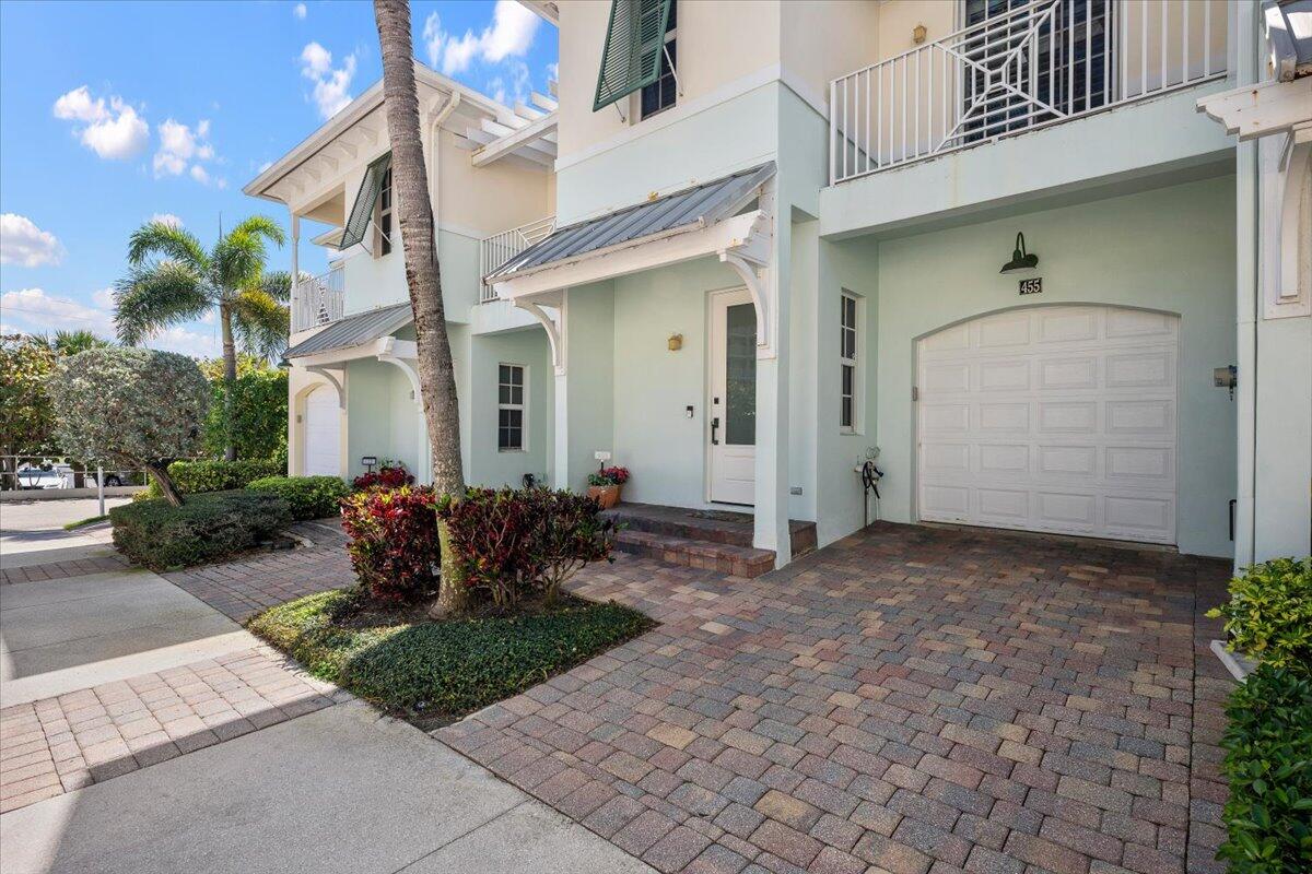 455 Ocean Ridge Way Juno Beach, FL 33408 - Photo 32 of 45 a front view of house with outdoor seating