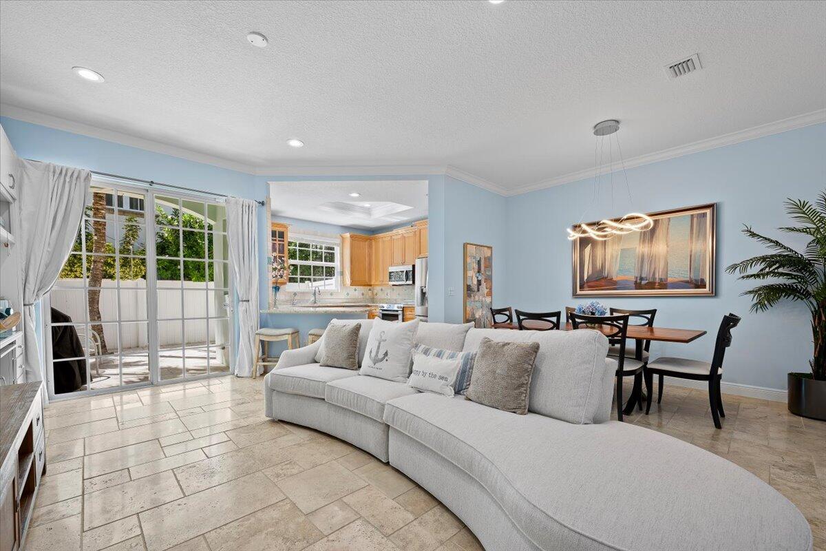 455 Ocean Ridge Way Juno Beach, FL 33408 - Photo 4 of 45 a living room with furniture and a flat screen tv